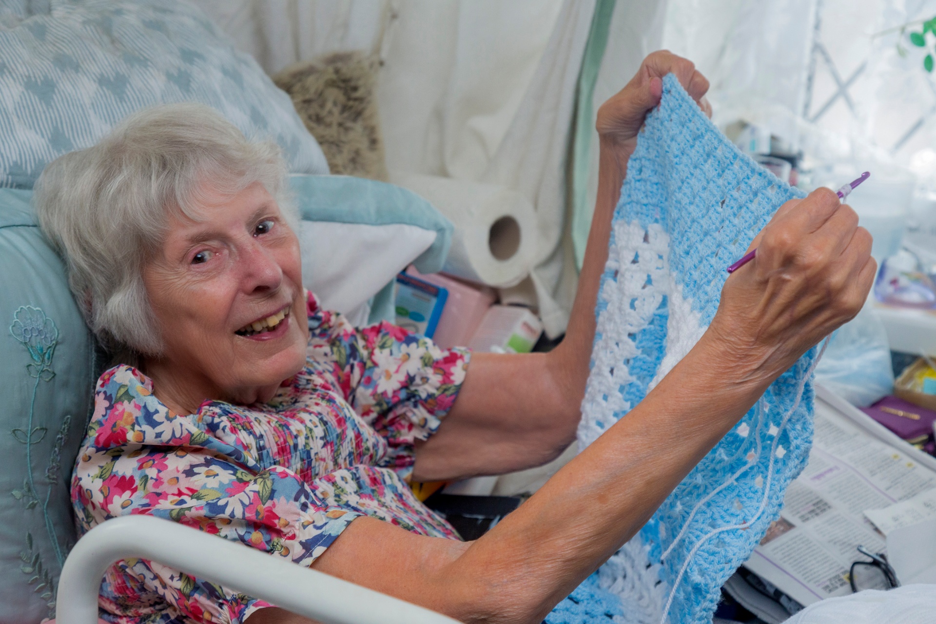 Carer and client enjoying time together in a garden